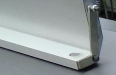 Hjælpeland til høvling af smalle emner